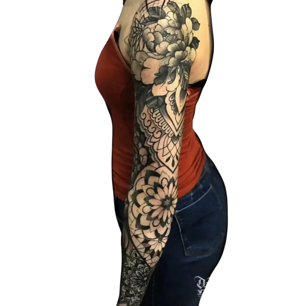 Women’s full arm sleeve tattoo mixing black and grey flowers with geometric mandalas by Duk Tattoo, Florida