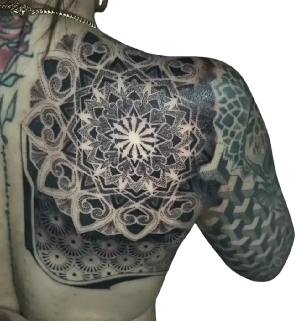 Shoulder and chest piece mandala shield tattoo with geometric honeycomb dotwork by Duk Tattoo, Florida