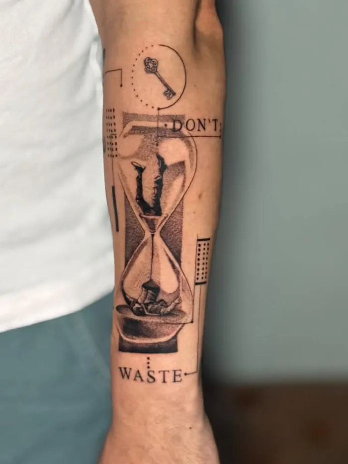 Fine line forearm tattoo of a surreal hourglass with a key and the words Don’t Waste, black and grey by Duk Tattoo, Boca Raton, Florida