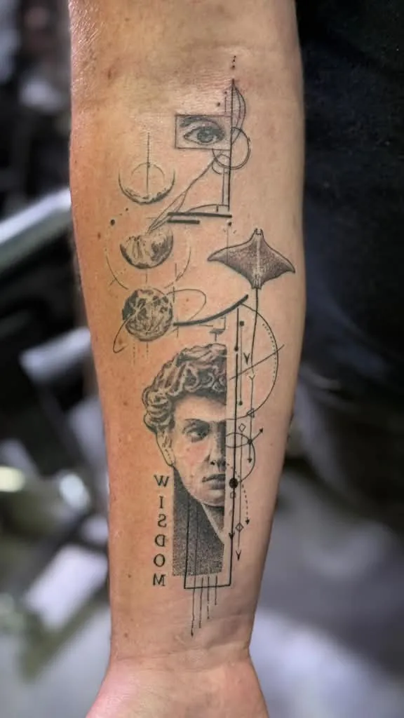 Fine line forearm tattoo of a classical bust with moon phases and the word Wisdom by Duk Tattoo, Boca Raton, Florida