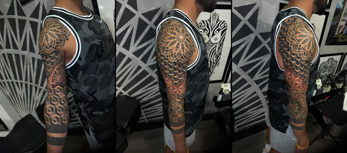 Full arm geometric sleeve tattoo with a shoulder mandala, 3D cube pattern and dotwork by Duk Tattoo, Boca Raton, Florida
