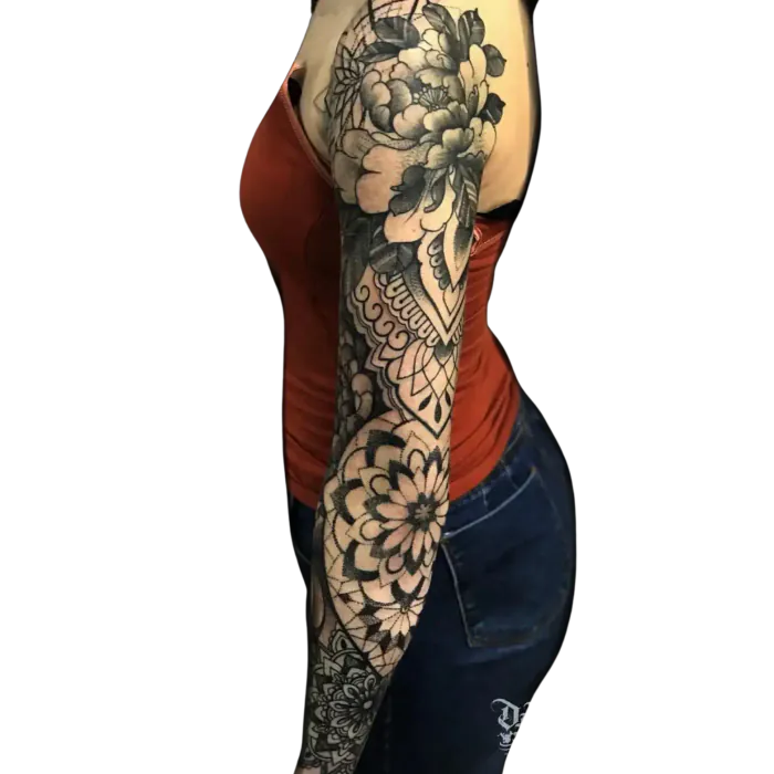 Women’s full arm sleeve tattoo mixing black and grey flowers with geometric mandalas by Duk Tattoo, Florida