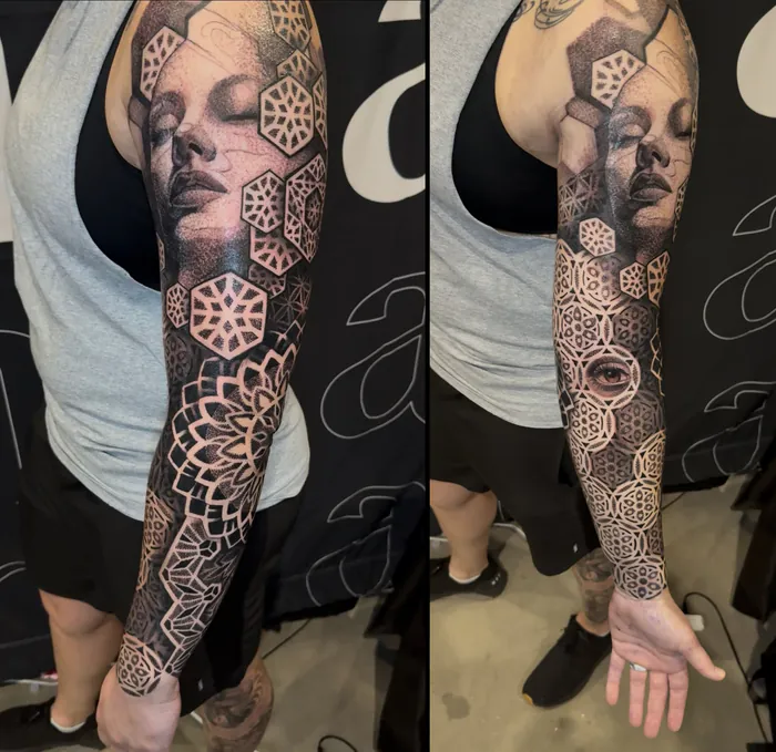 Full arm sleeve tattoo of a woman's portrait framed by geometric hexagons and mandalas in black and grey by Duk Tattoo, Boca Raton, Florida