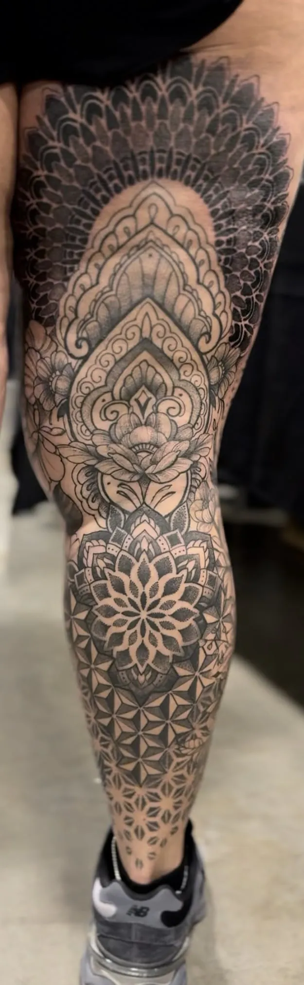 Full leg sleeve tattoo with ornamental mandalas, lotus patterns and flower of life in black and grey dotwork by Duk Tattoo, Boca Raton, Florida