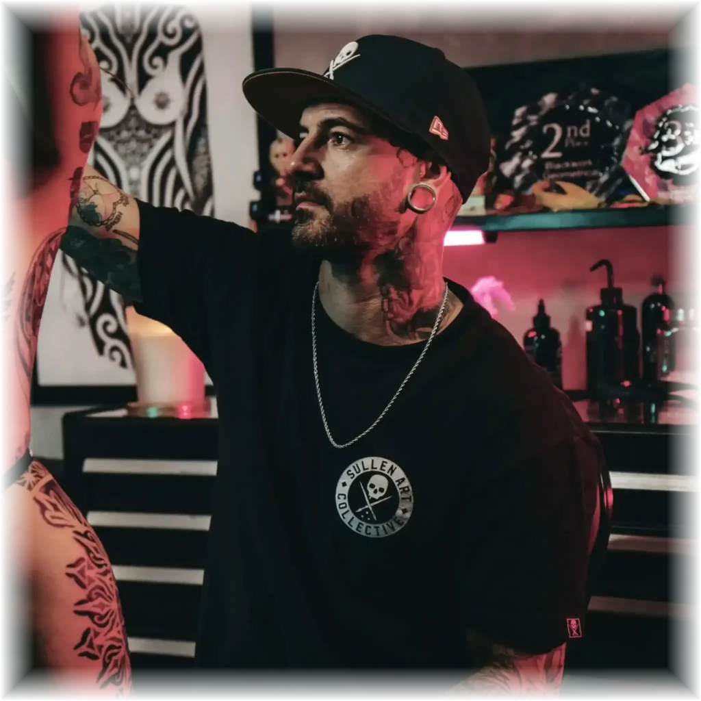 Back tattoo with floral and mandala design by Duk Tattoo in Boca Raton, Florida - geometric black & grey ink